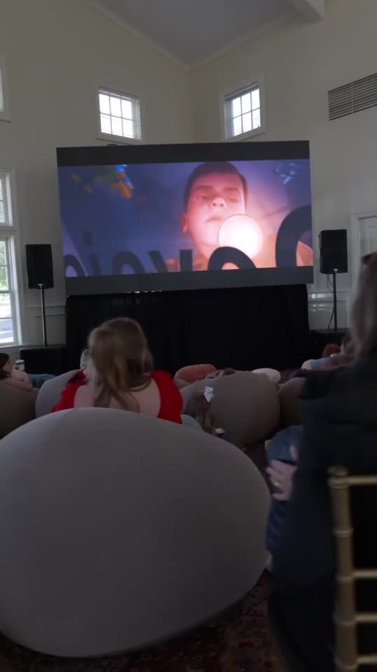 Holiday family movie day in a club ballroom: video wall and sound