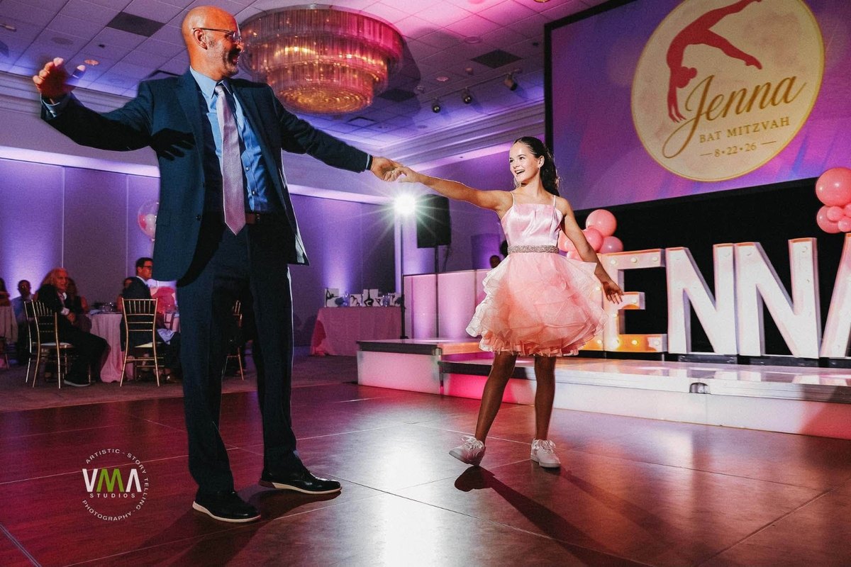Jenna's Bat Mitzvah: a dance with Dad in front of the ATG setup