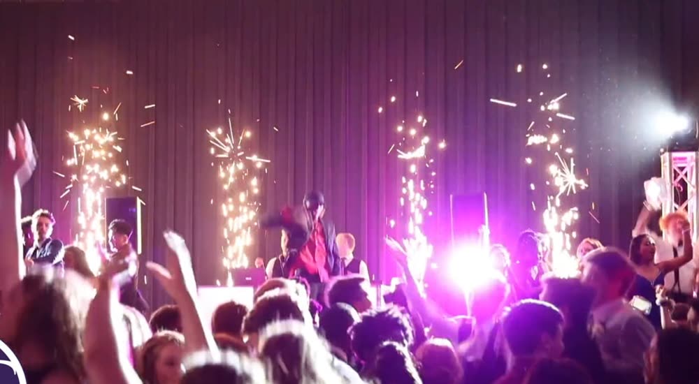 Cold sparks across the stage at a high school prom