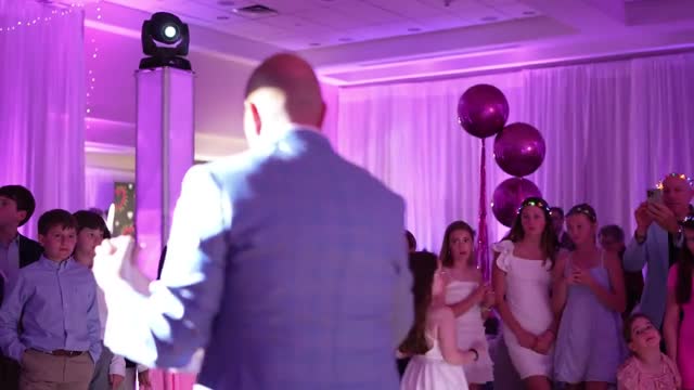 Bat Mitzvah with pink uplighting and pipe and drape