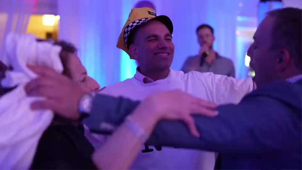 Bar Mitzvah boy lifted in a chair during the hora