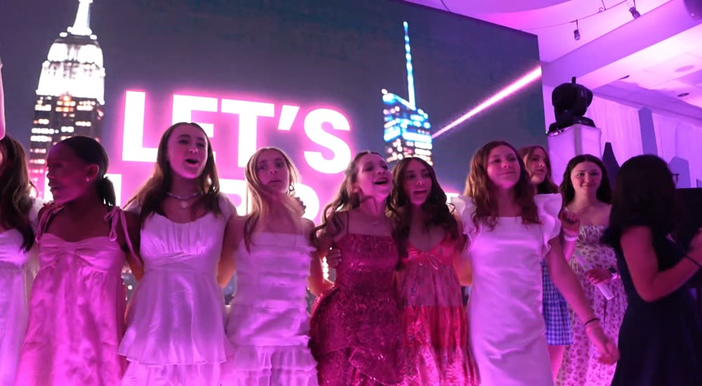 Teens with LED foam sticks under the ATG lights