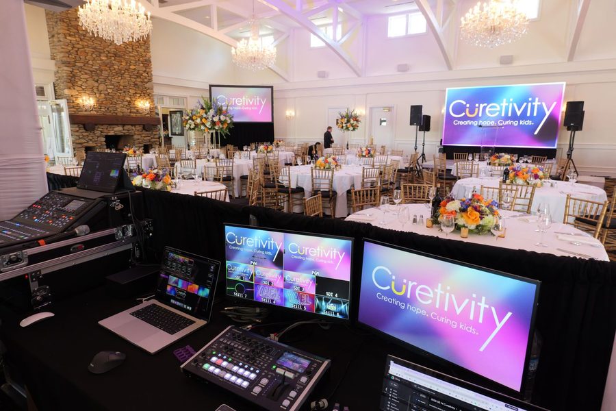 ATG AV desk running screens and sound at a gala
