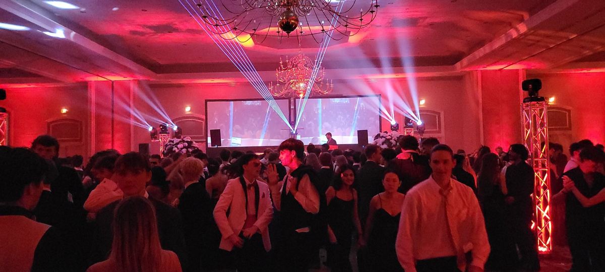 Lasers and LED wall over a packed dance floor