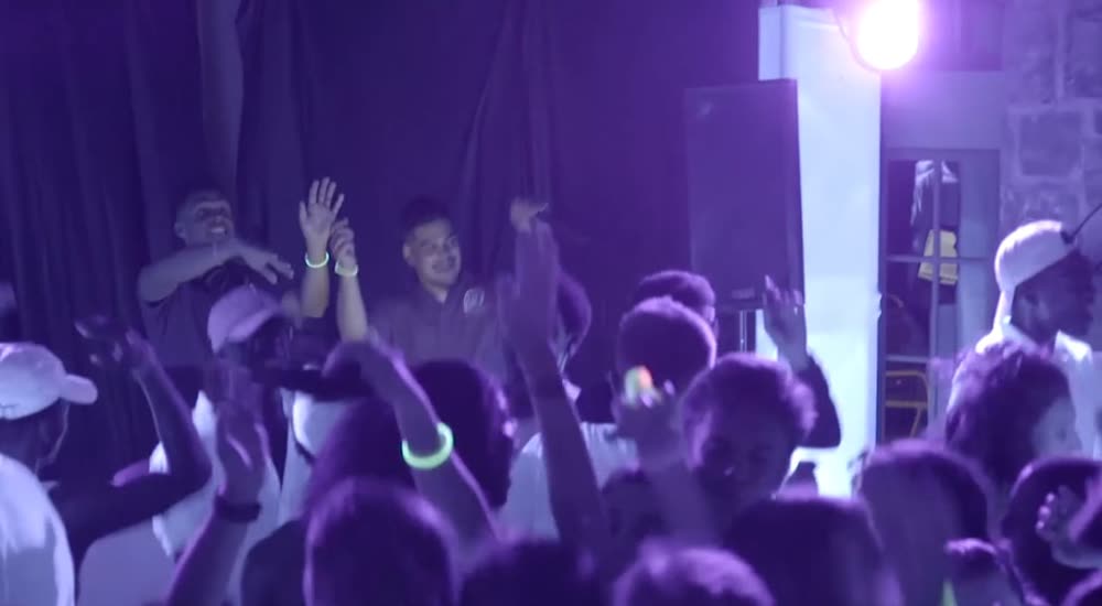 Sweet 16 glow party under blacklight