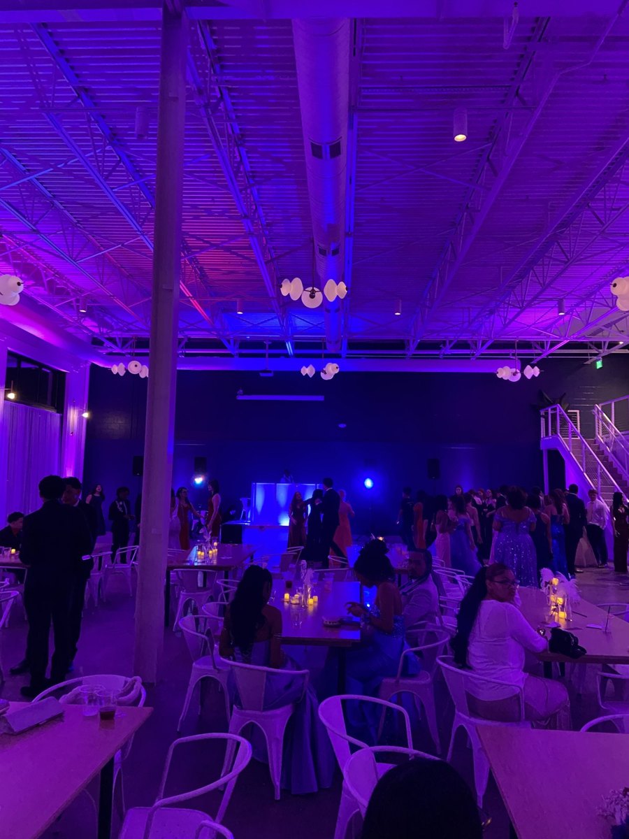Purple uplighting and a packed floor at Porter Ridge prom