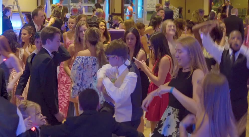 Crowd and cold sparks at a charity prom